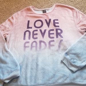 "Love never fades" sweater